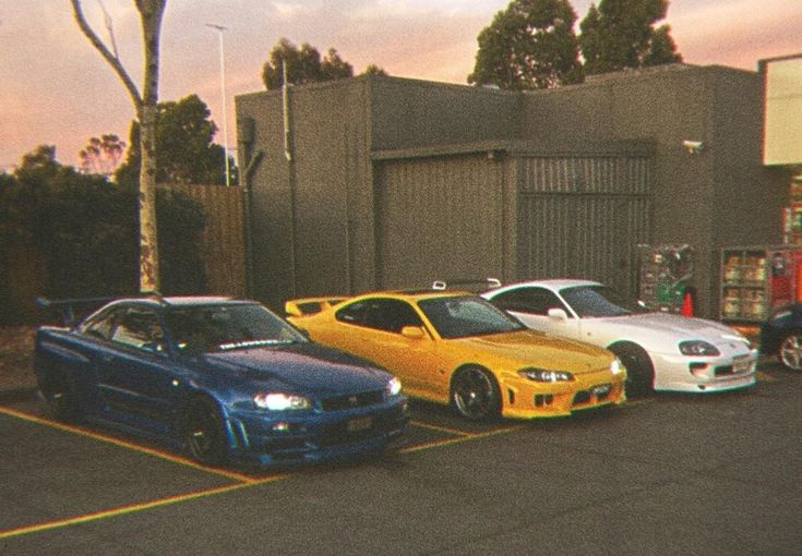 Cars lined up at a night car meet