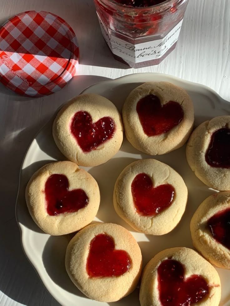 Raspberry jam heart cookies on a plate
